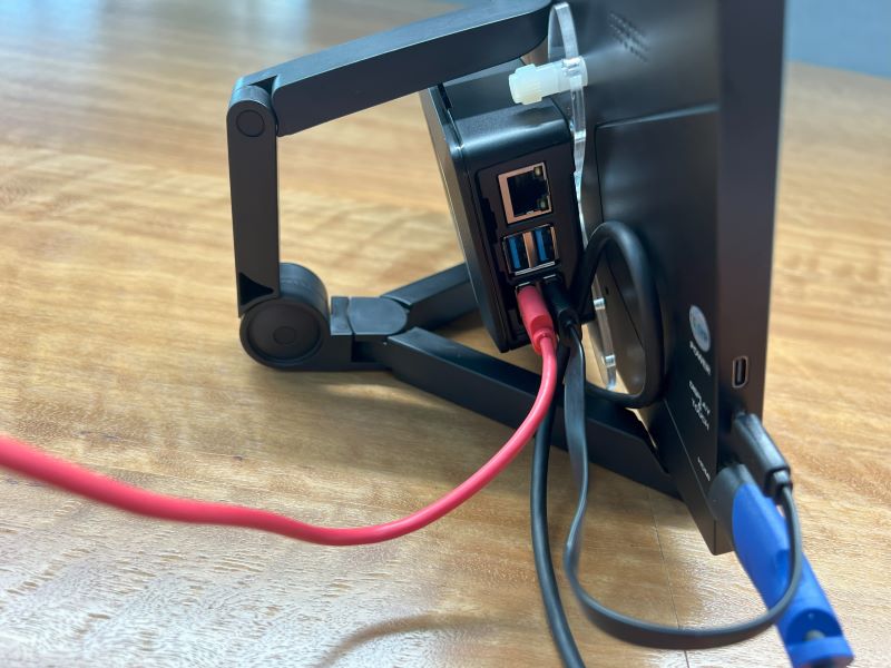 Close up image showing the keyboards USB cable connected to the Pi