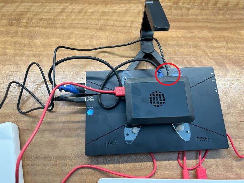 Image with the Pi folded down shwoing the Pi connected to the battery bank